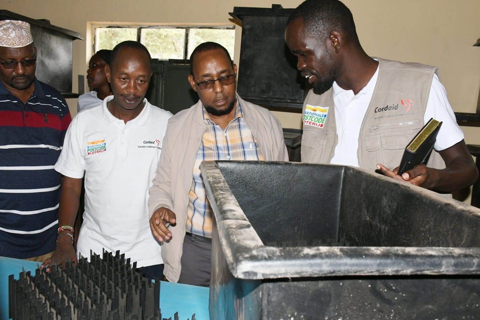 Isiolo youths empowered to tackle desert locusts with innovative animal feed solution - The ICIPE project implementors show the youth how to harvest the locust in Isiolo County on November 23, 2024. (Photo: Issa Hussein)