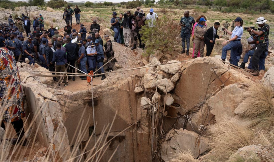 Families gather at South African mine shaft where hundreds are feared trapped