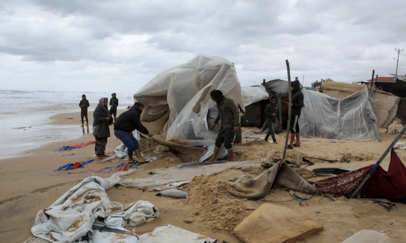 Rainstorms flood tents of Gaza's displaced as Israel steps up strikes