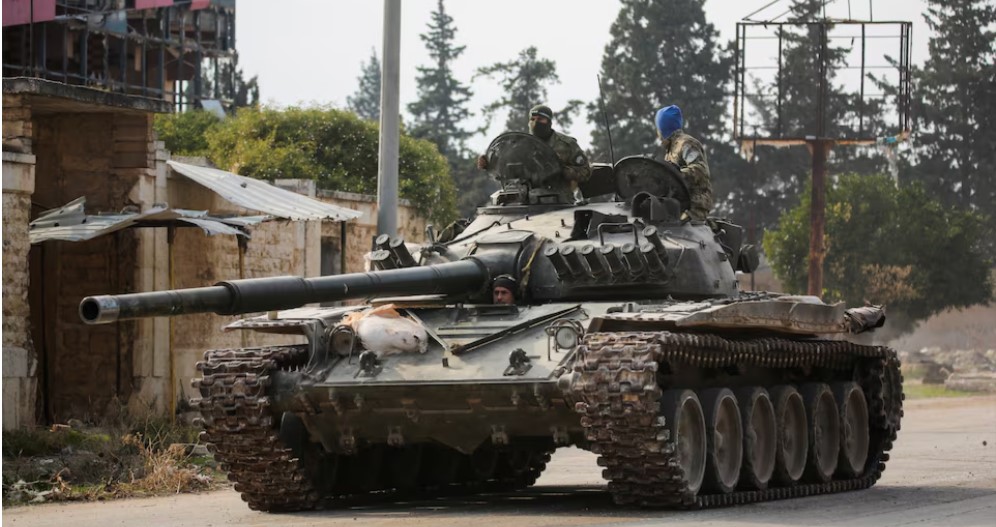 Syrian rebels sweep into Aleppo as army closes airport and roads, sources say - Rebels drive a military vehicle in al-Rashideen, Aleppo province in Syria on November 29, 2024. (Photo: REUTERS/Mahmoud Hasano)