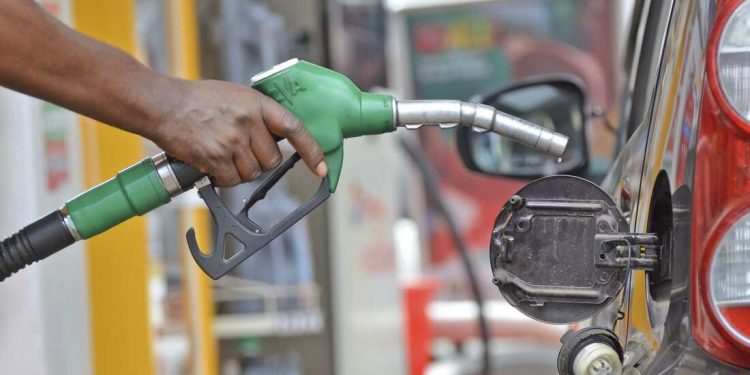 Fuel demand falls sharply despite drop in prices, KNBS reports - A filling station attendant fuelling a car. (Photo: Handout)