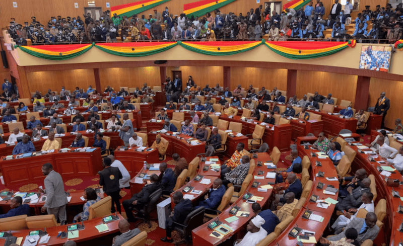 Ghana risks government shutdown if no budget passed before election - Parliamentarians and members of the public listen as Ghanaian President Nana Akufo-Addo delivers his annual state of the nation address to the parliament in Accra, Ghana, March 30, 2022. REUTERS