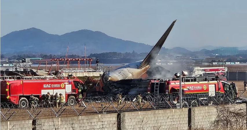 At least 62 dead, two crew rescued in fiery South Korean airliner crash at airport - Firefighters putting out fire on an aircraft which drove off the runaway at Muan International Airport in Muan, South Jeolla Province in South Korea on December 29, 2024. (Photo: Yonhap via REUTERS)