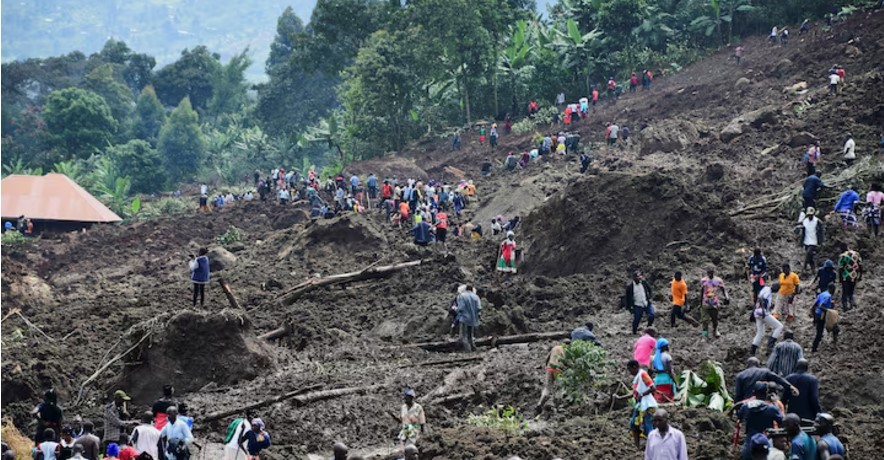 Death toll in Uganda landslide that buried several villages rises to 28 - People gather on November 29, 2024, at the scene of a landslide triggered by heavy rain that buried dozens of homes across several villages in Bulambuli district, Uganda. (Photo: REUTERS/Abubaker Lubowa)