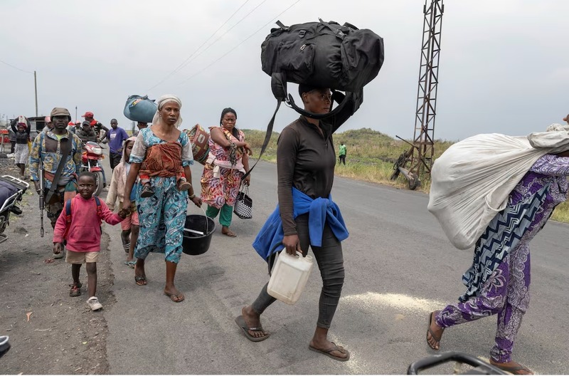 M23 rebels issue warning to UN and SADC forces as panic grips Goma, DRC - Civilians carry their belongings as they flee from the Nzulo camp for the internally displaced to Goma, as fighting intensifies between the M23 rebels and the Armed Forces of the Democratic Republic of the Congo (FARDC), near Goma, Democratic Republic of Congo January 22, 2025. REUTERS