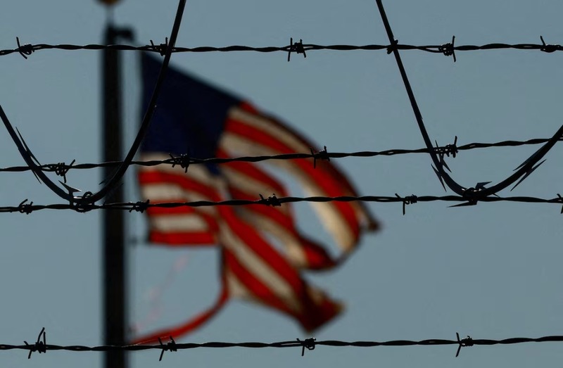 Over 1,200 Kenyans to be deported under Trump’s immigration directives - A United States flag is seen near the El Paso airport as Guatemalan migrants, mostly shackled, are being transported to a plane to be expelled from the United States to their country of origin by agents of the U.S. Immigration and Customs Enforcement (ICE) and Border Patrol agents, at the El Paso airport, Texas, U.S., June 13, 2024. REUTERS