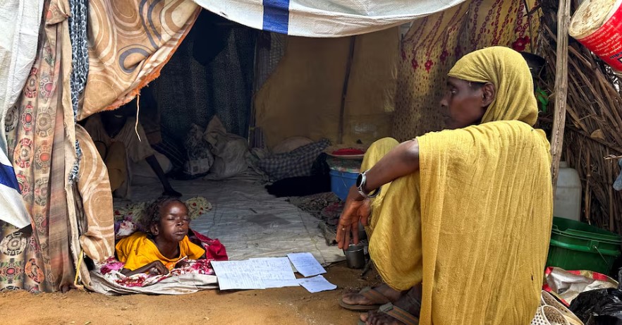 WHO chief urges end to attacks on Sudan healthcare after 70 killed in drone strike - A displaced Sudanese woman rests inside a shelter at Zamzam camp in North Darfur, Sudan on August 1, 2024.  (Photo: File/REUTERS/Mohamed Jamal Jebrel)