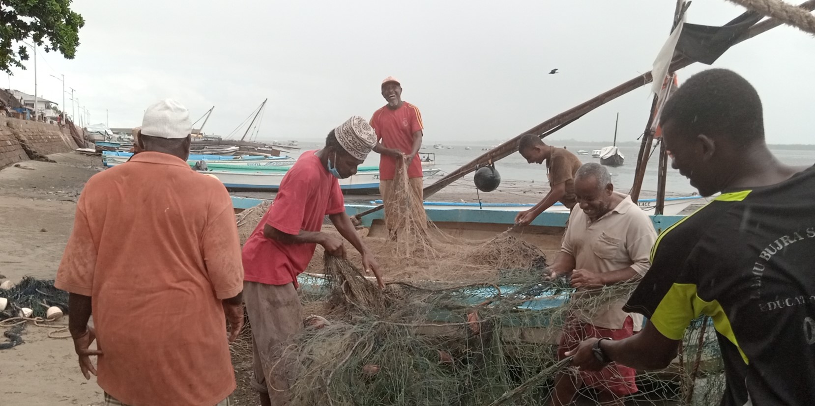 Why fishermen in Lamu are quitting the trade despite catching tonnes of fish - Fishermen in Lamu repair their nets in Lamu Old Town in readiness to go fishing before in the Indian Ocean. (Photo: Farhiya Hussein)