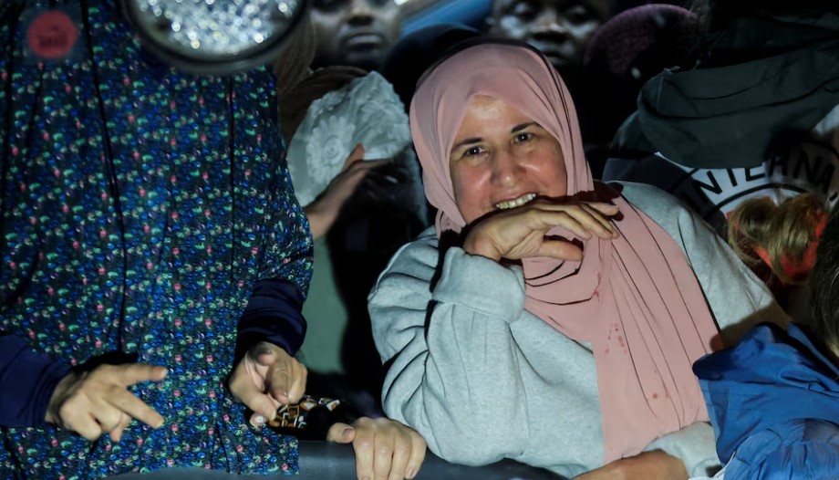 Hamas frees hostages, Israel releases Palestinian prisoners on day one of Gaza ceasefire - A freed Palestinian prisoner reacts from inside a bus that arrived with them after their release from an Israeli jail on January 20, 2025. (Photo: REUTERS/Mussa Qawasma)