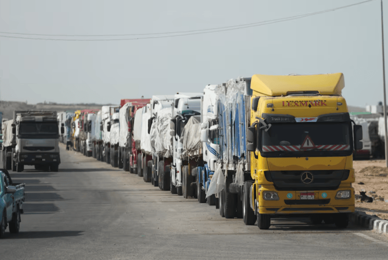 Relief workers' killing, aid blockade hamper UN humanitarian deliveries in Gaza - Aid trucks wait near the Rafah border crossing between Egypt and the Gaza Strip, amid a ceasefire between Israel and Hamas, in Rafah, Egypt, January 19, 2025. REUTERS