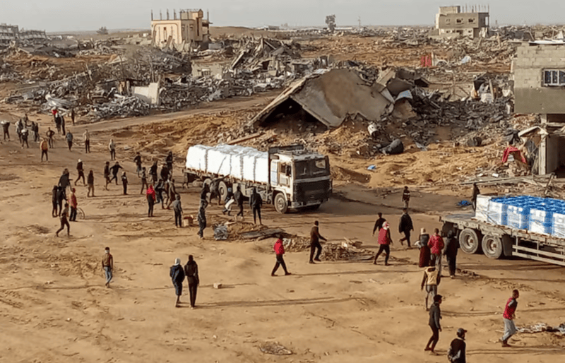 More Gaza funding needed to hit ceasefire targets, UN official says - Palestinians attempt to grab aid from a truck in Rafah in the southern Gaza Strip, January 23, 2025. REUTERS