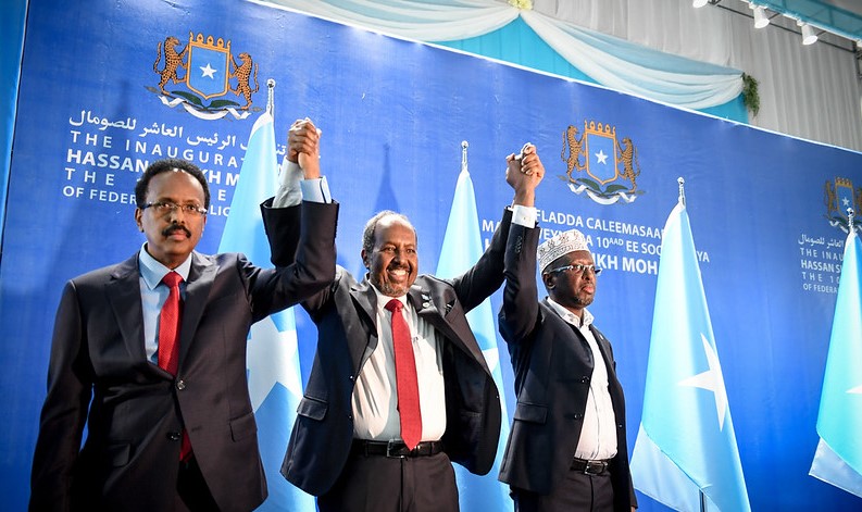 Somalia hopes for positive strides in 2025 as country moves away from troubled past - Somali President Hassan Sheikh Mohamud (centre) holds hands with former presidents Mohamed Abdullahi Farmaajo (left) and Sheikh Shariff Ahmed after Hassan's re-election in 2022. (Photo: AUSSOM)