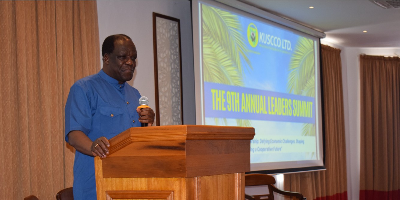 State wants police to probe KUSCCO as report shows financial statements signed by dead auditor - Cooperatives CS Wycliffe Oparanya speaking at KUSCCO's 9th Annual Leaders’ Summit. (Photo: X/KUSCCO)