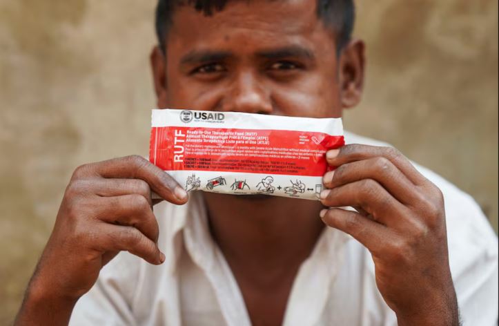 TB, malaria, newborn health services must restart, says USAID memo - Muhammad Shukkur, 35, a Rohingya man, poses for a picture with a nutrition supplement packet, that has been provided by USAID among Rohingya refugees, in Cox's Bazar, Bangladesh, February 5, 2025. (Photo: REUTERS/Ro Yassin Abdumonab)