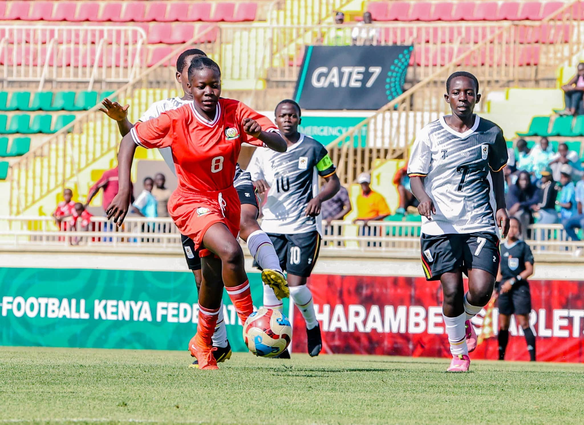 Junior Starlets dominate Uganda to edge closer to FIFA U-17 Women’s World Cup - Lindey Weey Atieno dribbles past her Ugandan markers (C) FKF Media 