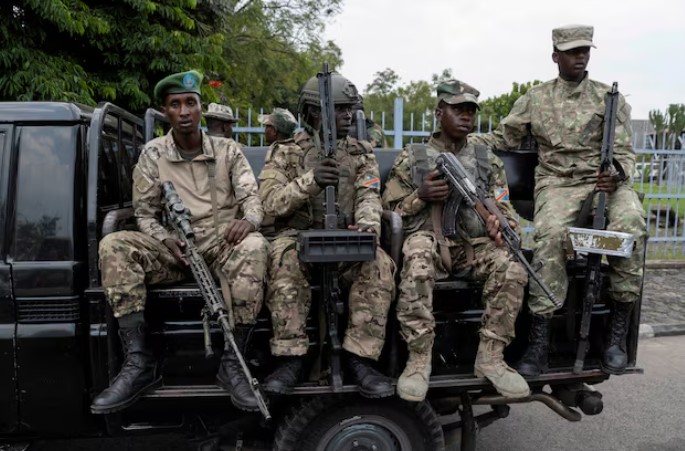 EU to sanction nine people over Congo violence, diplomats say - M23 rebels sit on a truck during the escort of captured FDLR members (not pictured) to Rwanda for repatriation, at the Goma-Gisenyi Grande Barrier border crossing, March 1, 2025. (Photo.REUTERS).