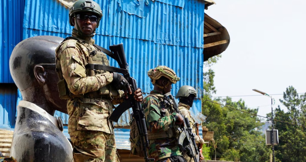 DR Congo’s M23 rebels say they will withdraw from seized town to support peace push - Members of the M23 rebel group stand guard as people attend a rally in Bukavu addressed by Corneille Nangaa, the coordinator of the AFC-M23 movement. (Photo: File/REUTERS/Victoire Mukenge)