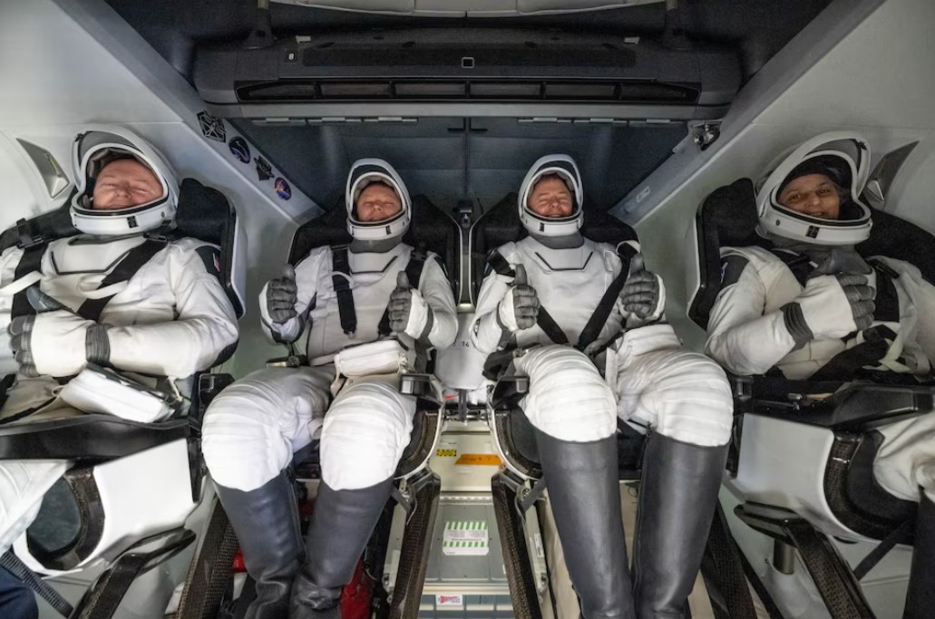 NASA astronauts 'Butch and Suni' return to Earth after drawn-out mission in space -  NASA astronaut Butch Wilmore, Nick Hague, and Suni Williams and Roscosmos cosmonaut Aleksandr Gorbunov are seen inside a SpaceX Dragon spacecraft onboard the SpaceX recovery ship MEGAN shortly after having landed in the water off the coast of Tallahassee, Florida, Tuesday, March 18, 2025. (Photo: NASA/Keegan Barber)