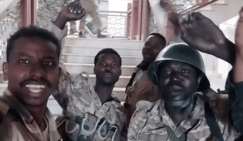 Sudanese army seizes control over main headquarters of central bank, military sources say - Sudanese army members film themselves inside the presidential palace, after, according to the Sudanese army, they took the control of the presidential palace, in Khartoum, Sudan, March 21, 2025, in this screengrab obtained from a social media video. Social Media via REUTERS