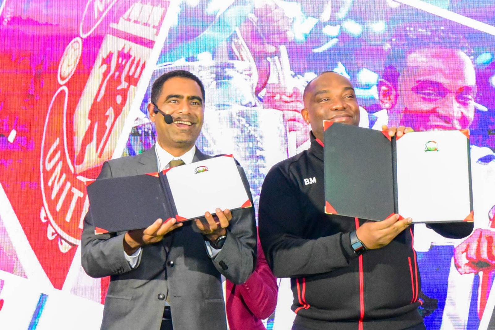 South African coach Sheryl Botes applauds Benni McCarthy for taking over Harambee Stars - New Harambee Stars coach Benni McCarthy displays his contract alongside FKF president Hussein Mohammed during his unveiling in Nairobi on March 3, 2025. (Photo. FKF Media).