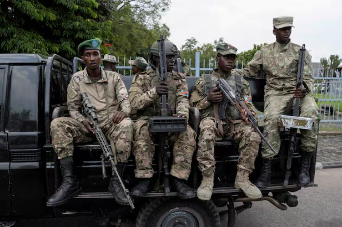 M23 rebels enter another eastern Congo town, defying calls for ceasefire - M23 rebels sit on a truck during the escort of captured FDLR members (not pictured) to Rwanda for repatriation, at the Goma-Gisenyi Grande Barrier border crossing, March 1, 2025. (Photo: REUTERS/Arlette Bashizi)